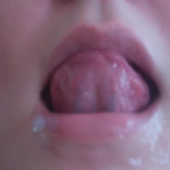 She is showing her pretty tongue in close up