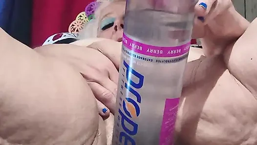 Big Bottle Plugged Clit Cunt