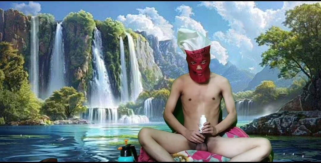 Masturbating with a dildo made from a bottle, used under a waterfall.