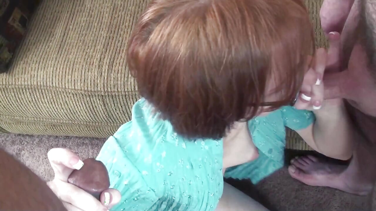 Sexy brunette sucks black and white cock in threesome