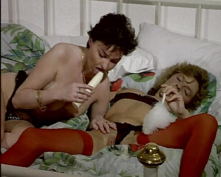 Sexy French whores sharing big toys on the bed