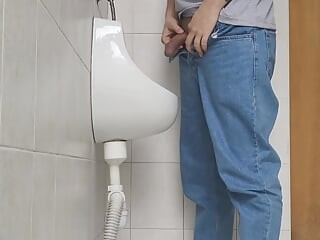 Risky jerk in public urinal at work