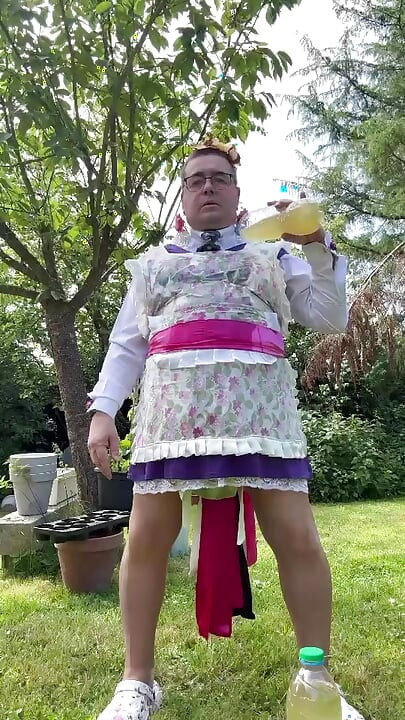 In gardener's clothes to take a piss shower outside fully dressed