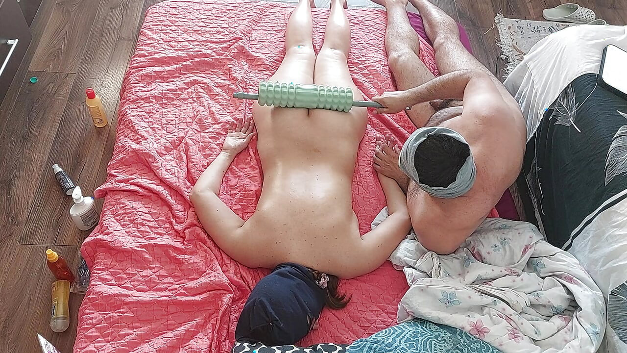Sensual massage of a hot couple with oil on the body. Foreplay in the bedroom with an amateur couple.