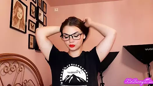 Sensual brunette smoking and wearing geek glasses
