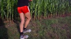 Moving in the fields in red Adidas shiny Boyshorts.AVI