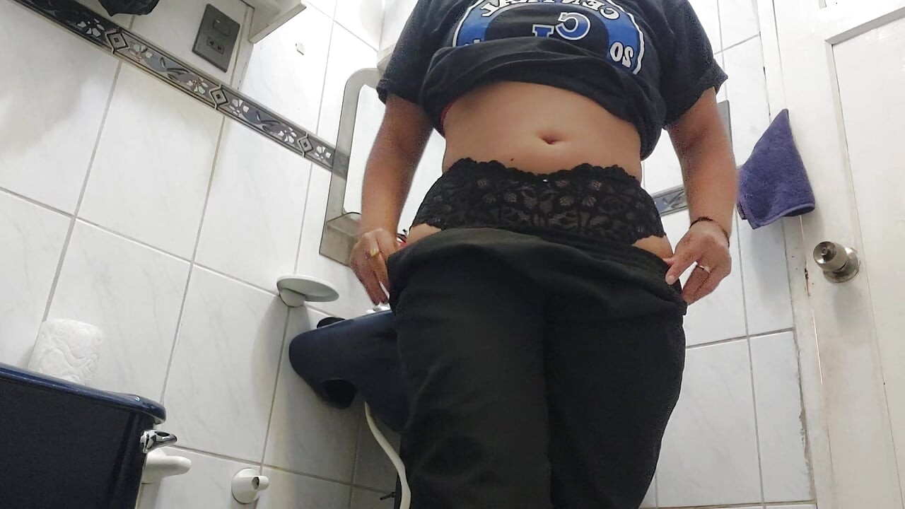 Colombian big ass takes a shower in a black thong and then changes.