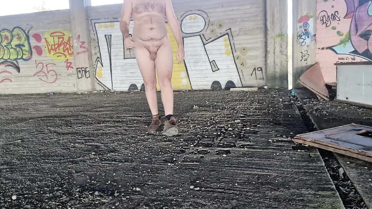I pose completely naked in the backyard