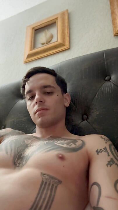 Adult starts to insert piercing into hole and pre