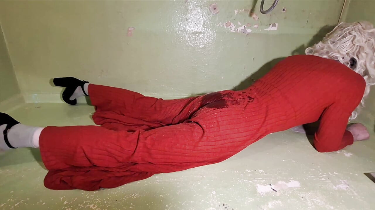 In the shower in a long red dress