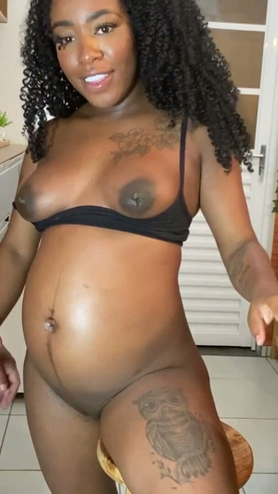 Hot pregnant woman studied in the kitchen while drinking water, but ended up drinking milk in her mouth. | Clip 3