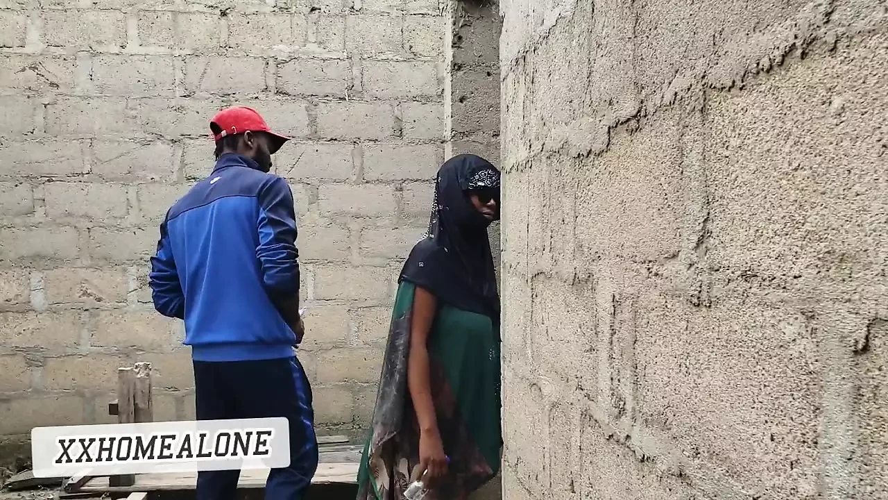Big-titted Nigerian slut fucking in an uncompleted building.