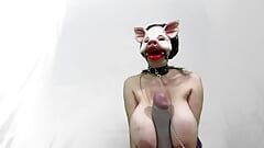 Masked pig slut sucks dildos and boob bouncing