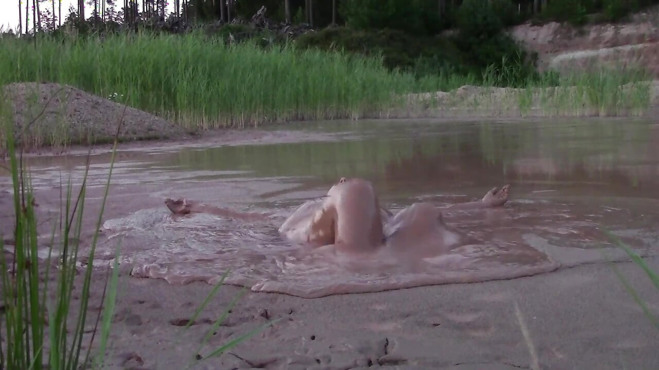 Mud Bath in Deep Quarry Mud Pond