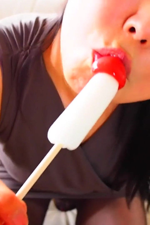 Horny Asian MILF sucking on candy dick