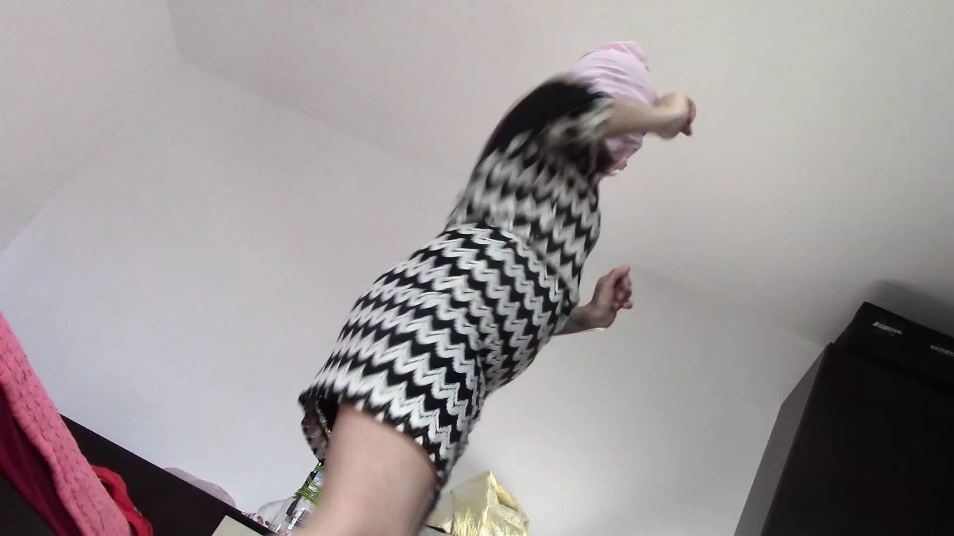 Amateur wife dancing naked at home. Amateur woman has fun trying on clothes and cutting them