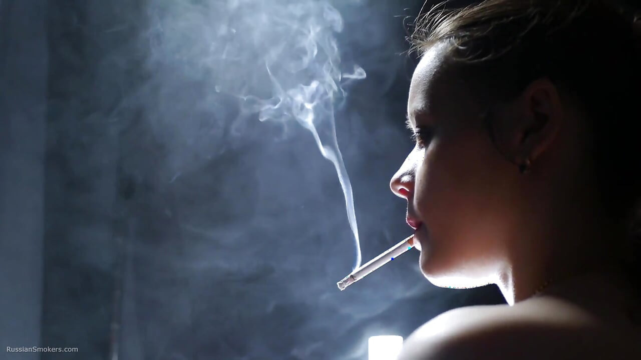 Topless Brunette Smoking in Dramatic Smoke