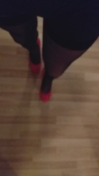 Mystery TS walking in super high heels red shiny stockings