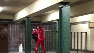 Cruising at trainstation in red pvc suit