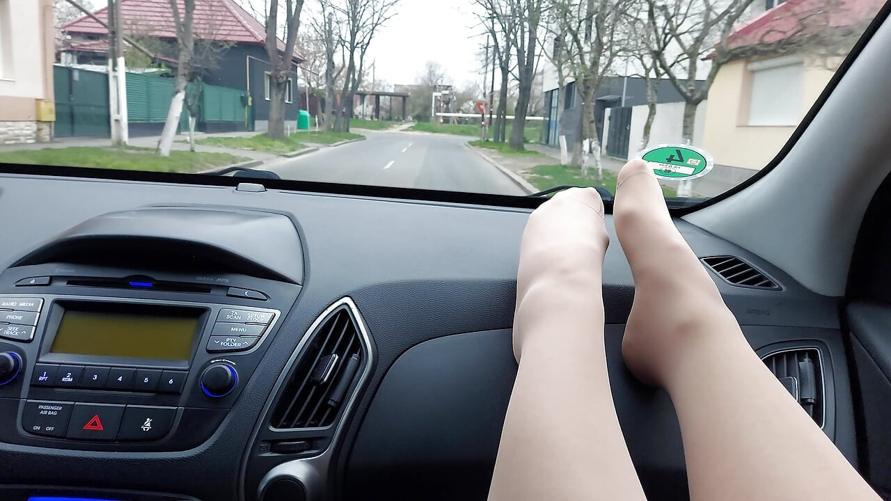 Elegant stepmom teases her stepson in the car in public