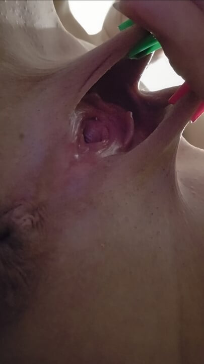 Ana Liz tortures and stretches her tight pussy with tweezers in close-up...