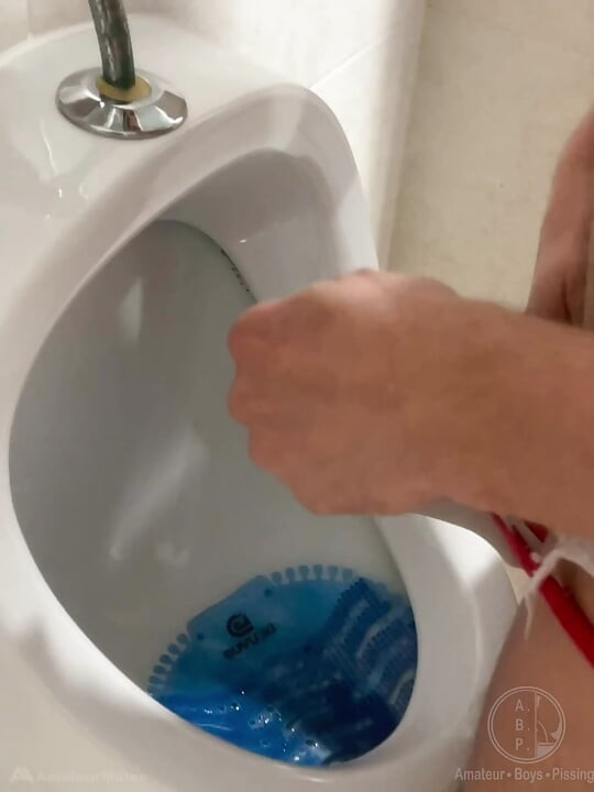 2 Boys Having Fun at the Pool Public Toilets' Urinal