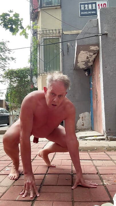 Naked dog pee in public