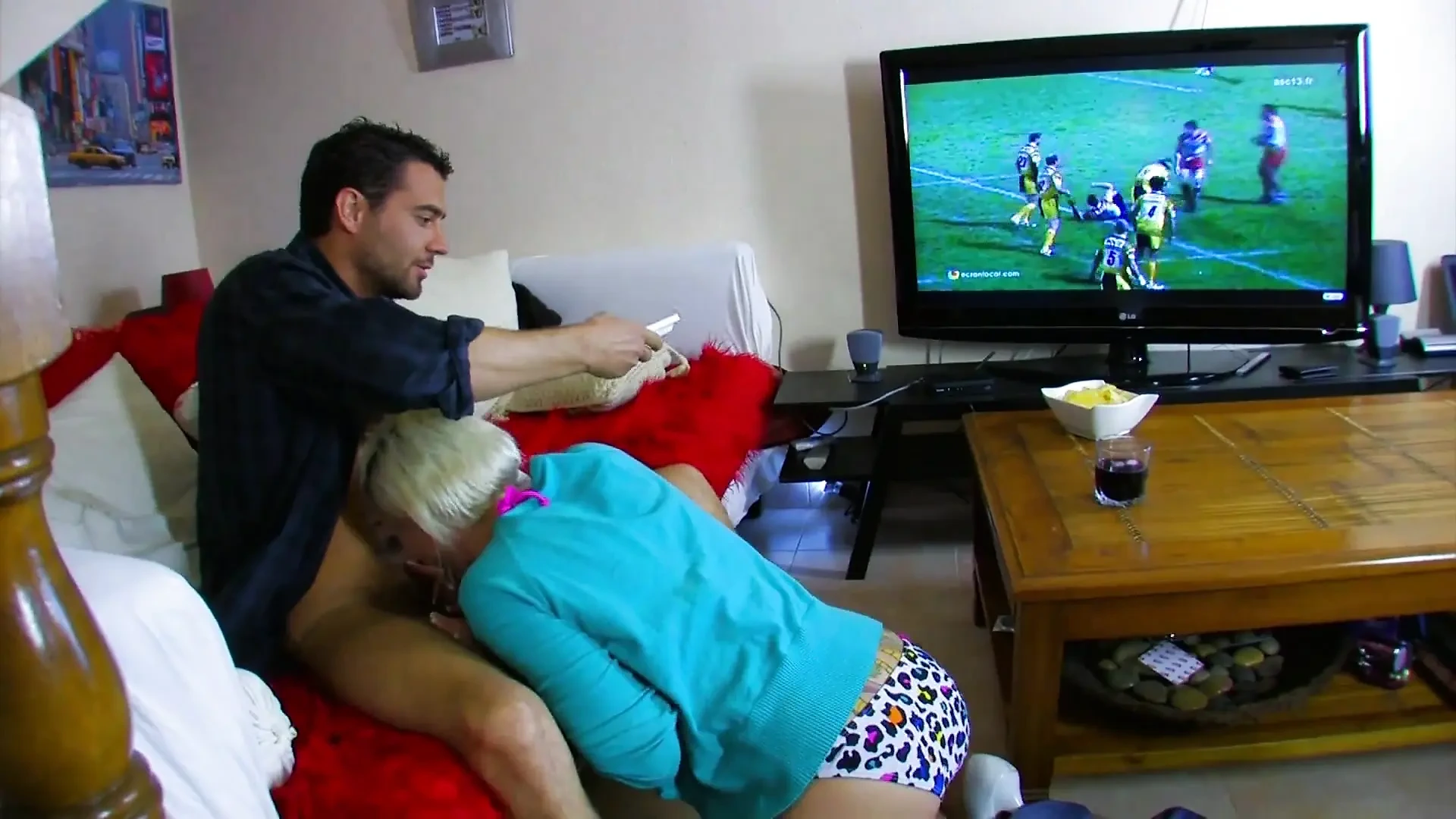 Man watching TV is seduced by a stunning blonde who wants to be ass fucked