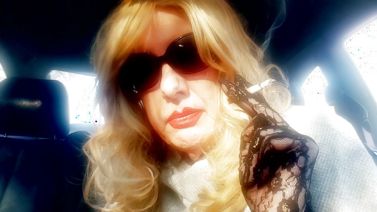 MRS. ROMAN SMOKING MARLBORO 100's IN HER CAR