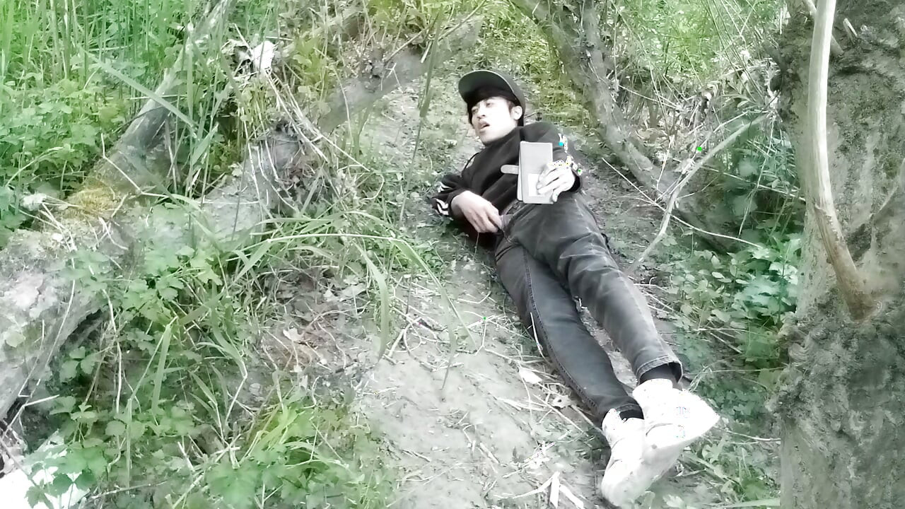 Cute Jon Arteen Gay twink jerks off outdoors, dry-humps the air, and shoots cum through a hole in his pants