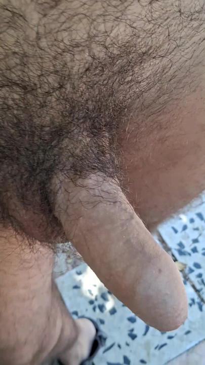 Walking naked with semi-hard cock