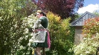 In a planter's outfit for pruning shrubs