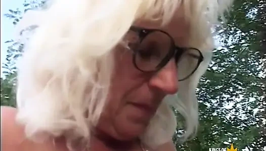 Mature woman gets fucked with passion by young guy outdoor