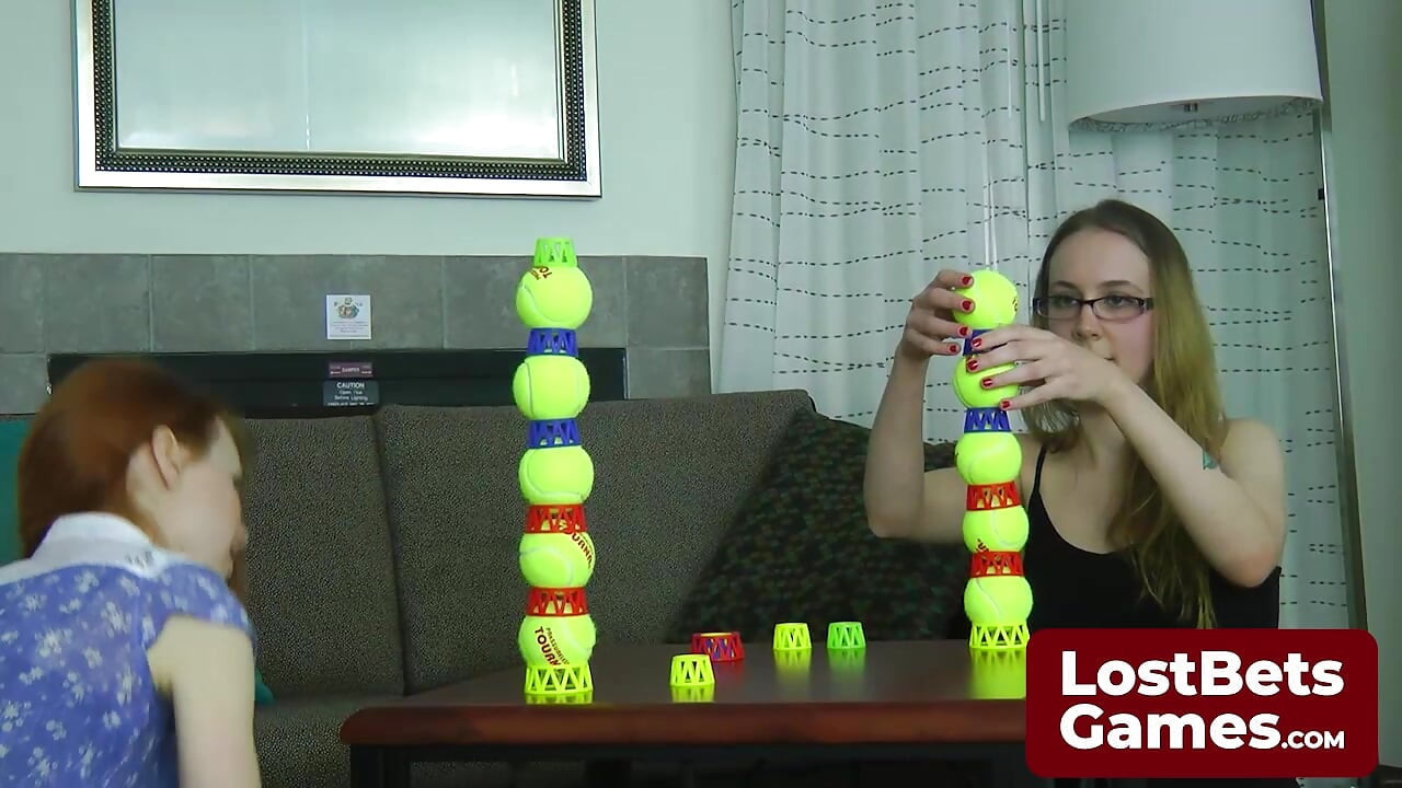 Two lesbians in an intimate Strip Ball Stacks challenge