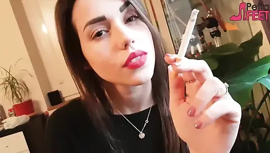 Smoking in close up with a beautiful girl