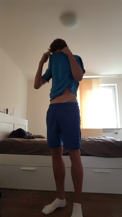 Twink in sportswear strips naked