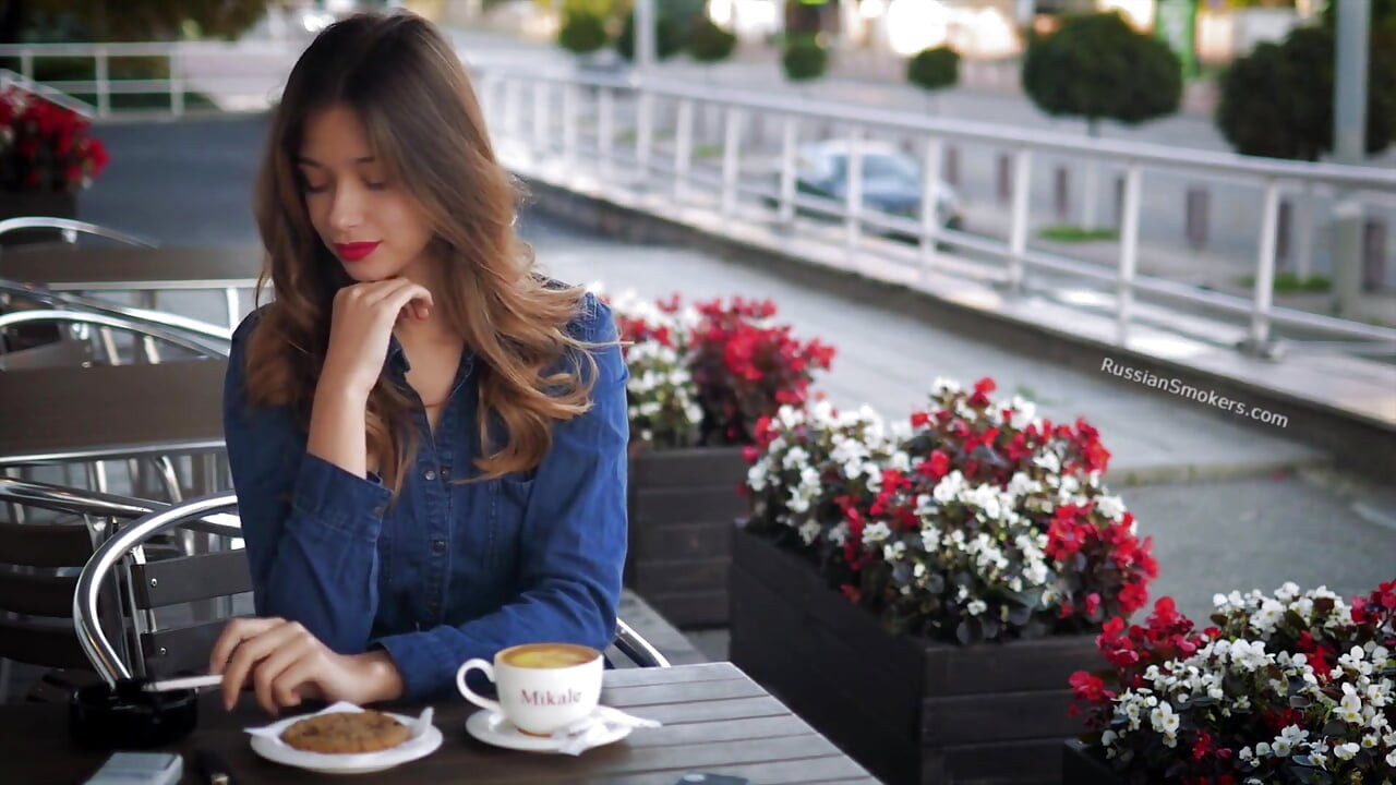 Magnetic Russian Beauty Playing with Cigarette Smoke