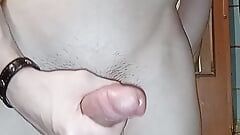 A cute young guy in the bathroom jerks off his hot and appetizing penis with a vibrator, and in the end violently cums!
