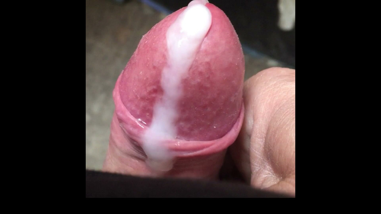 close up of uncut cock spunking