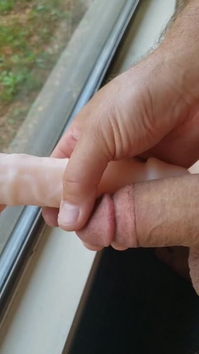 Stroking my cock with my dildo