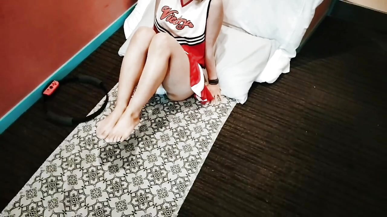 A cute, busty married woman does exercise 1 in an erotic cheerleader costume. Home made amateur Private Shoot