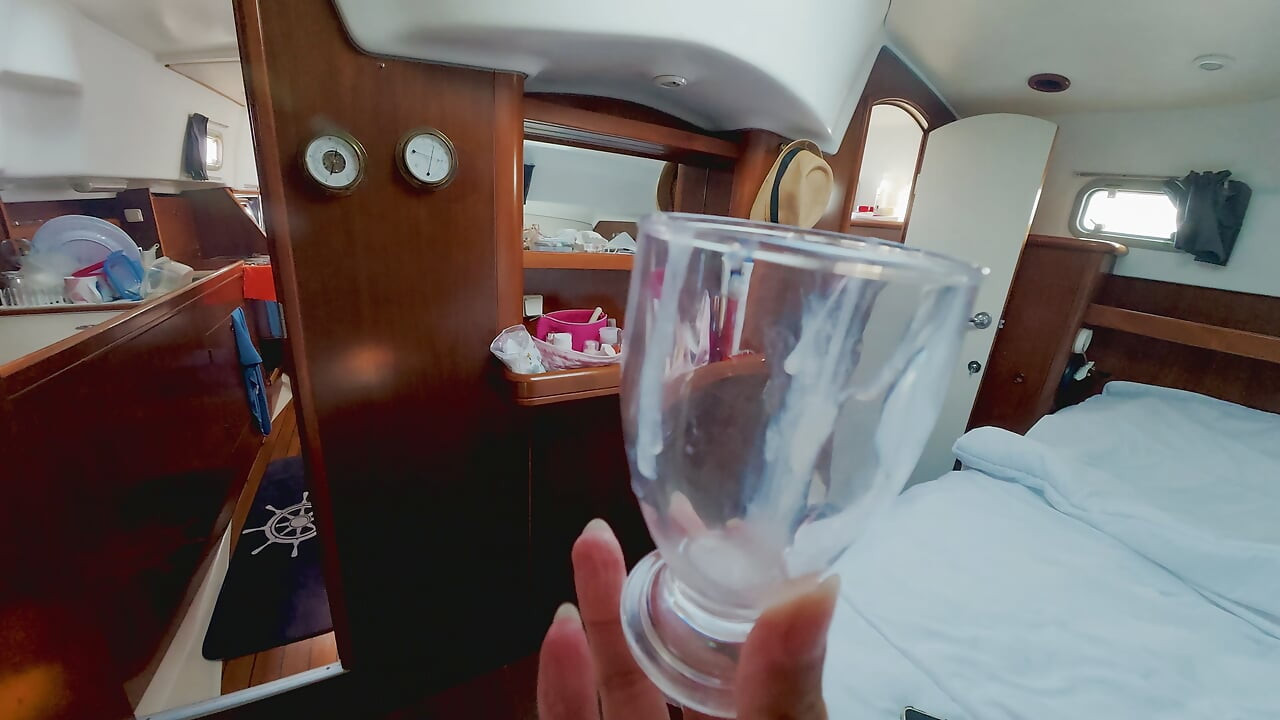 Trans masturbation while sailing and cum shot in the cup inside the boat
