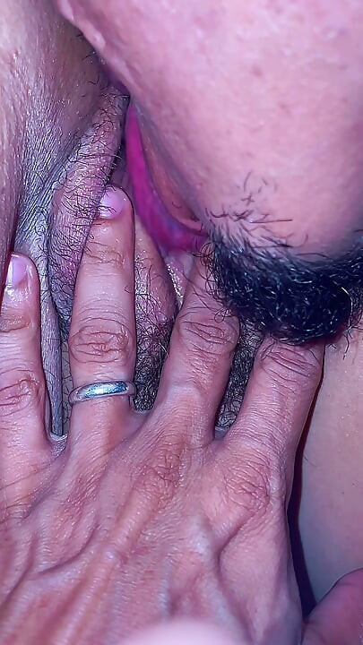 A lustful masseur caught the MILF off guard and licked her all over from behind, exploring her hairy pussy