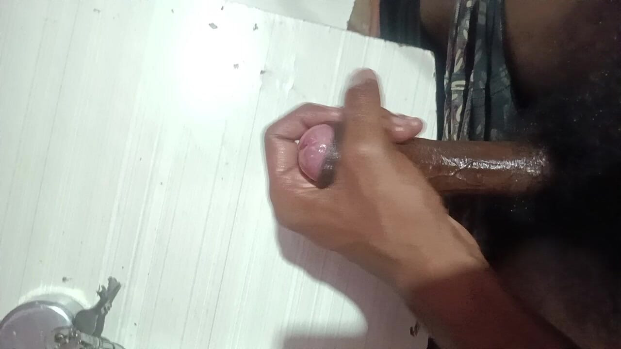 Young Indian guy stroking his cock