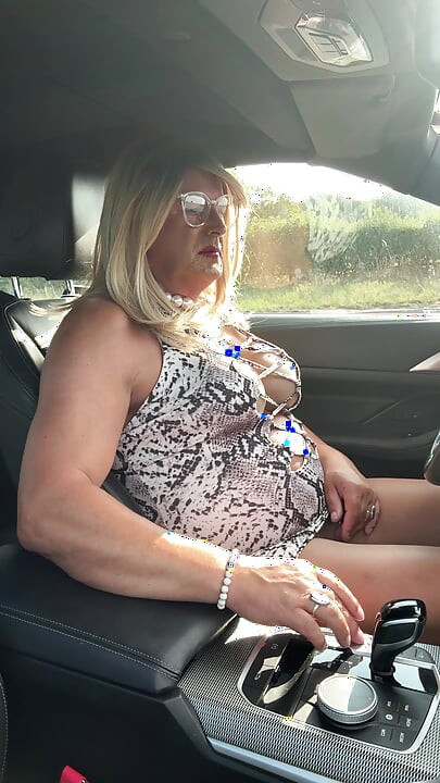 Sexy Crossdresser kellycd2022 in white animal print and pantyhose enjoying an afternoon drive