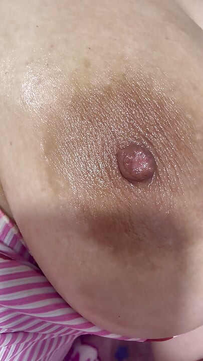 Mom oils herself very delicious and massages her tits
