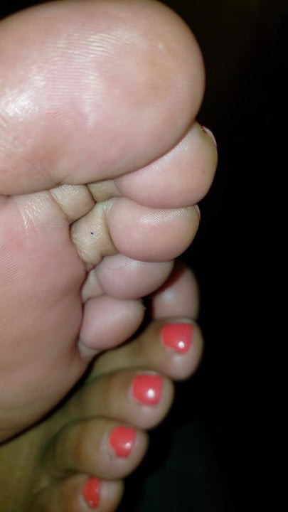Wife relaxing feet on me