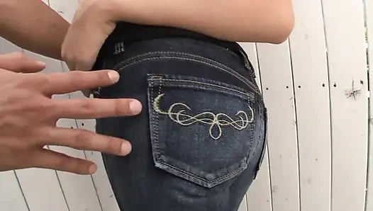 Skinny girl moans in pleasure as she gets fucked by a huge cock through torn jeans
