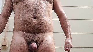 Hairy daddy showers outdoors, cums and then pisses!