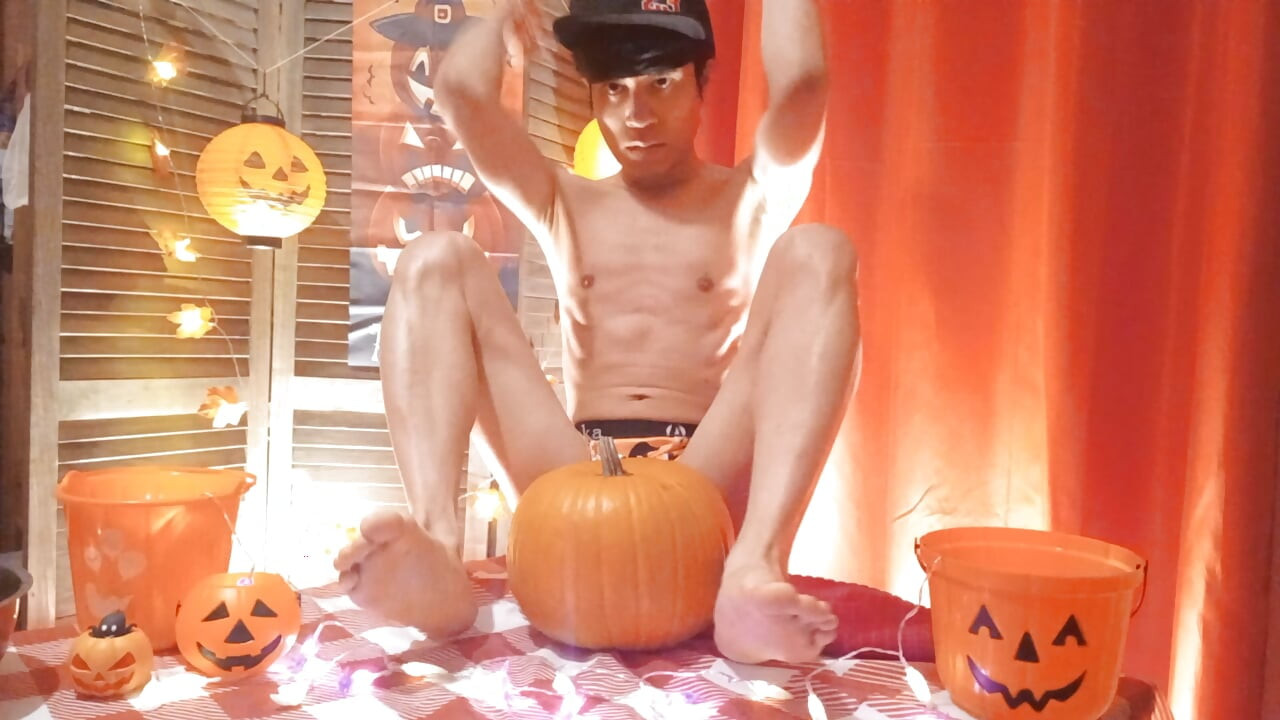 Cute twink Jon Arteen performs a sensual dance while carving a Halloween pumpkin